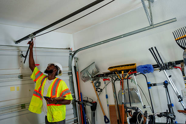 Professional Garage Door Installation technician working in Winfield, MO